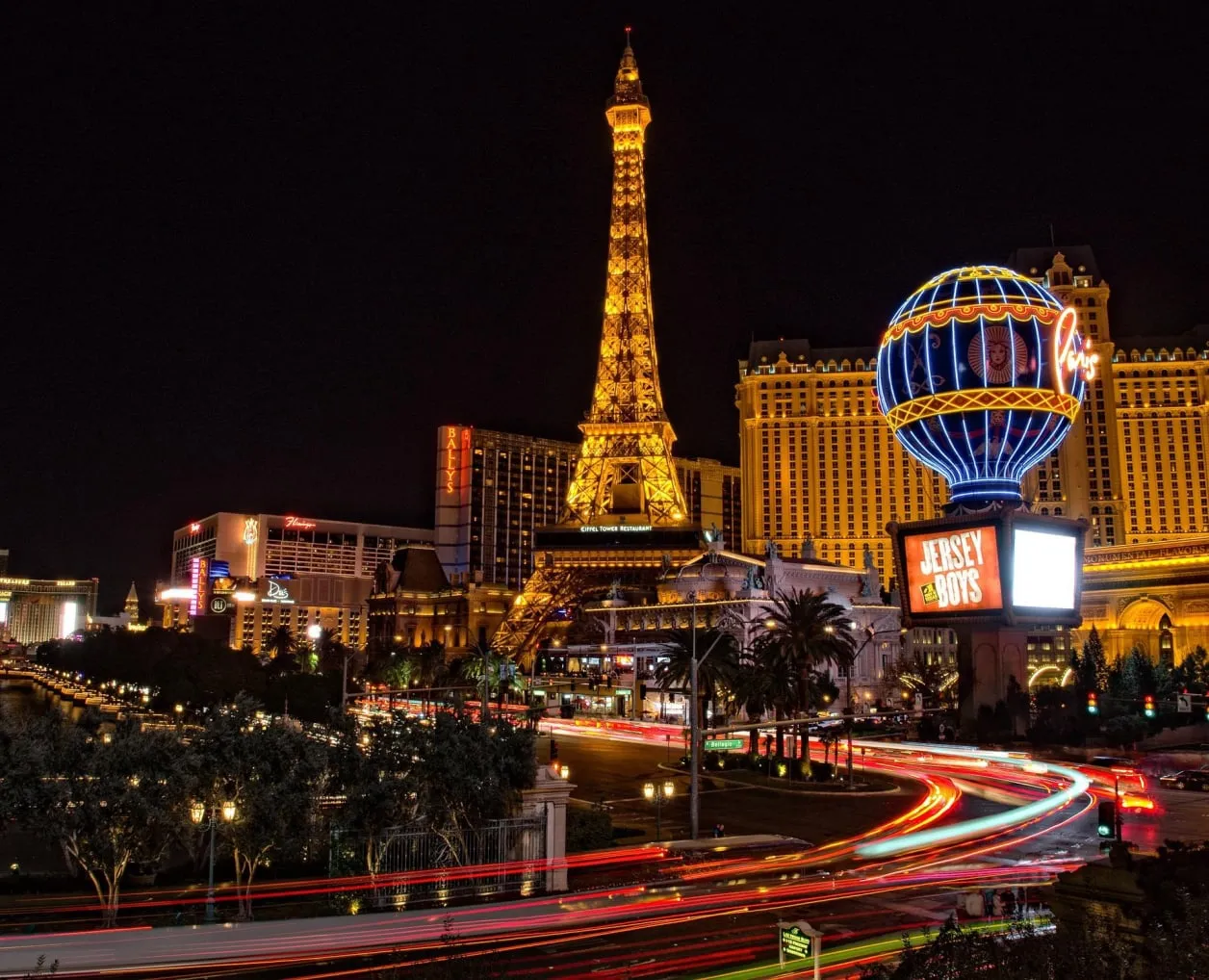 Nighttime entertainment district with illuminated hotel buildings