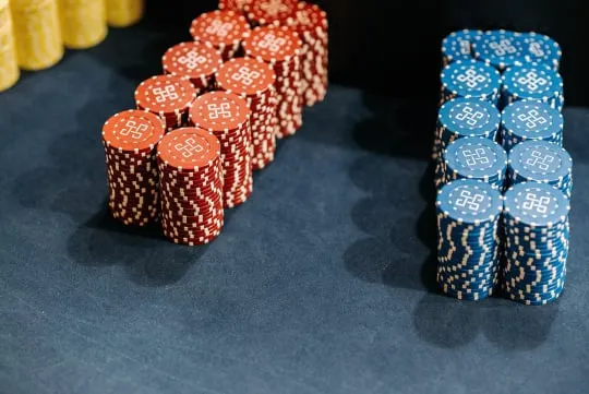 Poker chips arranged in stacks on a table