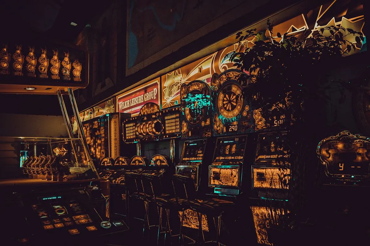 Brightly lit casino floor with rows of machines