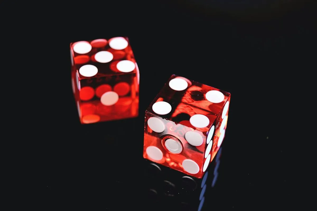 Red dice on a dark table