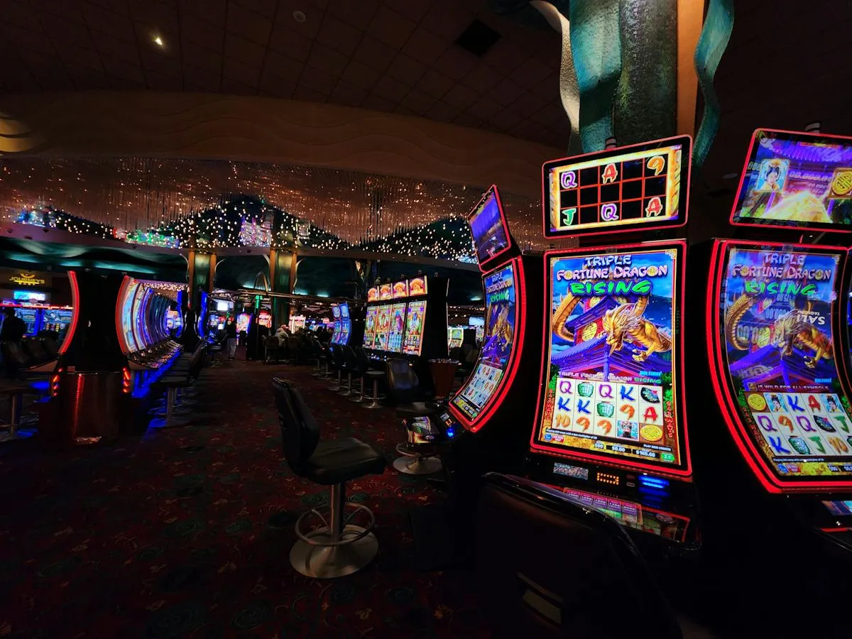 Casino interior with illuminated slot machine aisles