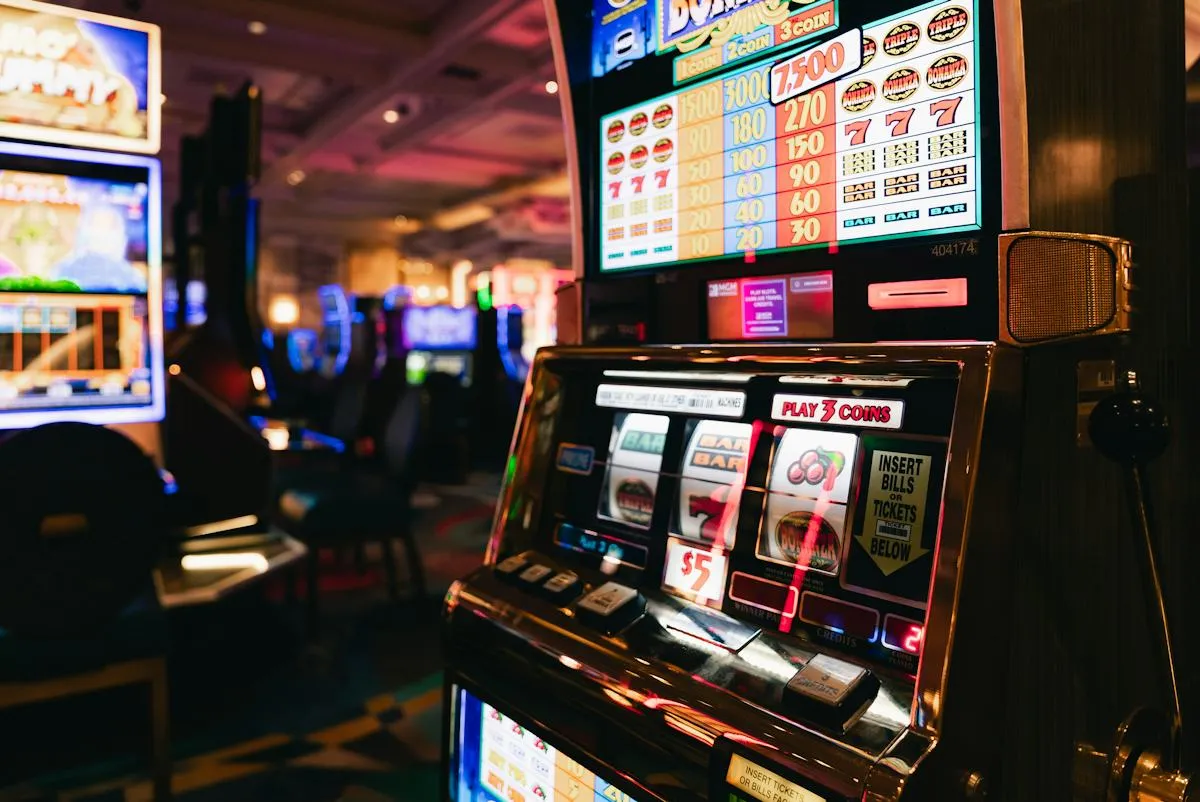 Row of slot machines with bright display panels